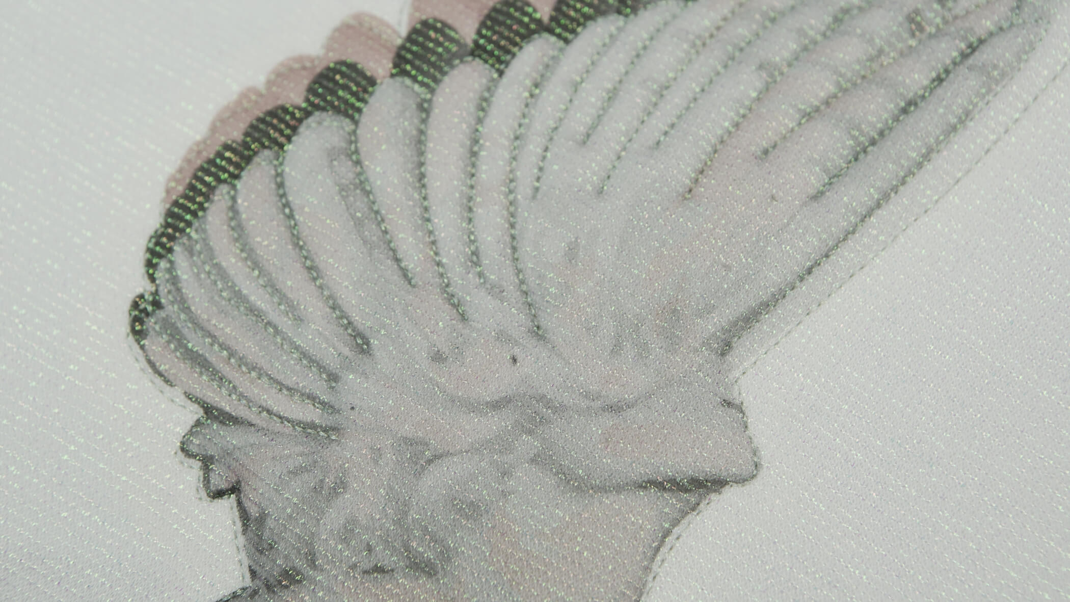 Detalhe de bordado acolchoado desenvolvido pela Bordados Oliveira em que se vê uma asa